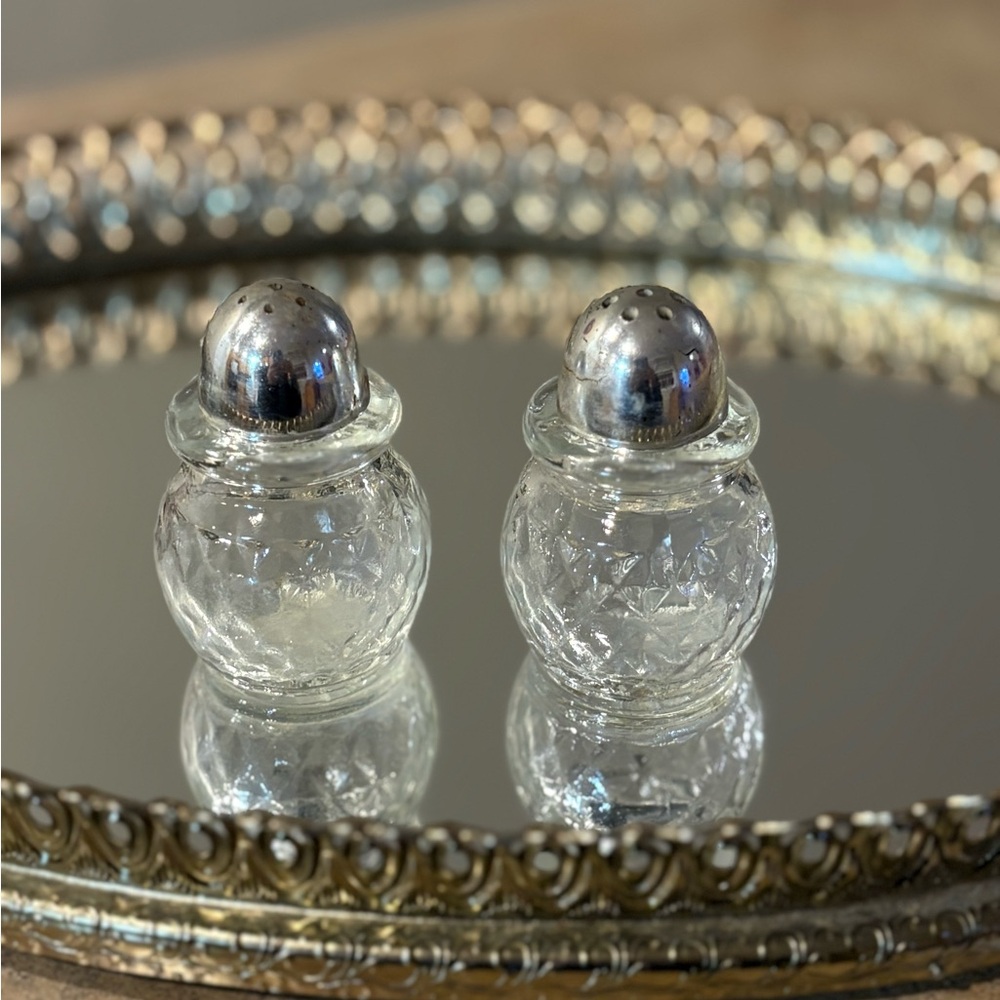 Vintage glass salt and pepper shakers with a quilted or diamond pattern